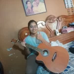 happy customer with their left hand guitar